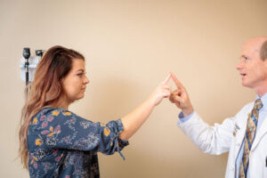 Clinical trial participant Taylor Hutton (left) meets with Randall J. Bateman, MD, director of the global DIAN-TU Alzheimer’s clinical trial in 2018. Hutton’s family has a history of early-onset Alzheimer’s disease. The DIAN-TU is launching three new arms to evaluate experimental Alzheimer’s drugs targeting the protein tau. (Photo: Matt Miller/School of Medicine)