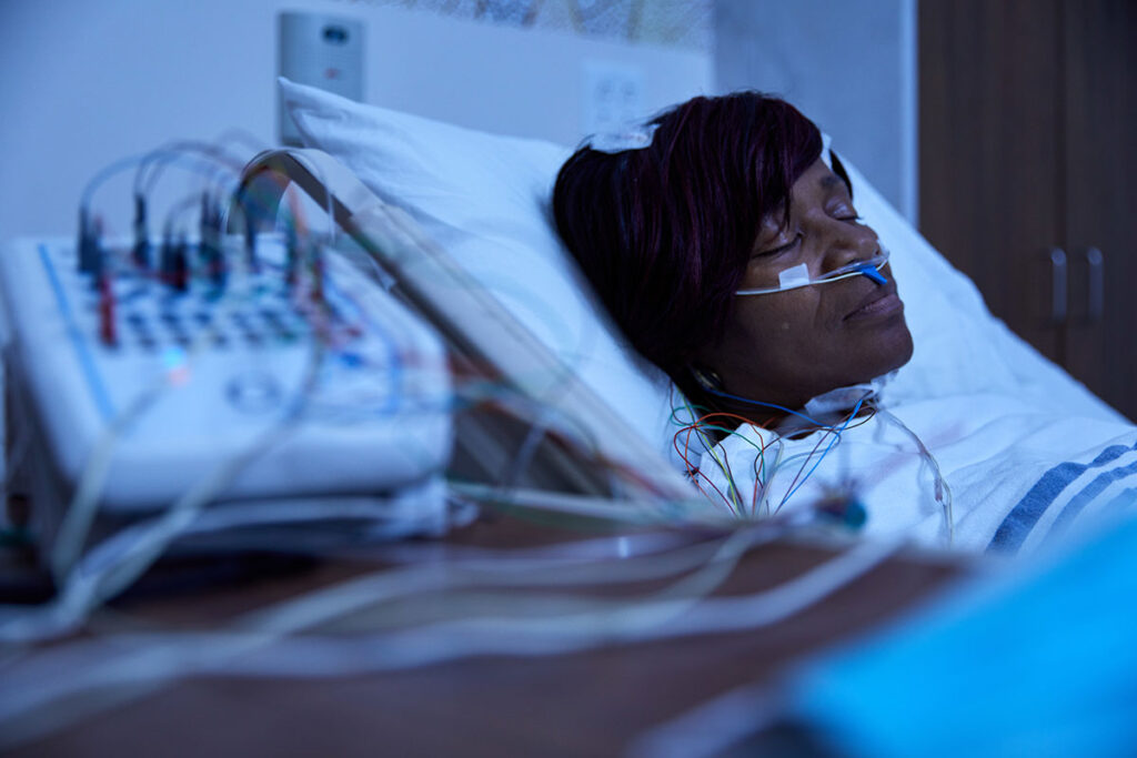 A study participant wears monitoring equipment as part of a sleep study on REM sleep behavior disorder. Researchers at Washington University School of Medicine in St. Louis, Mayo Clinic in Rochester, Minn., and The Neuro (Montreal Neurological Institute-Hospital) of McGill University have received a five-year grant expected to total $35.1 million for an extension of a study designed to develop biomarkers that indicate which people with the sleep disorder will go on to develop neurodegenerative diseases.