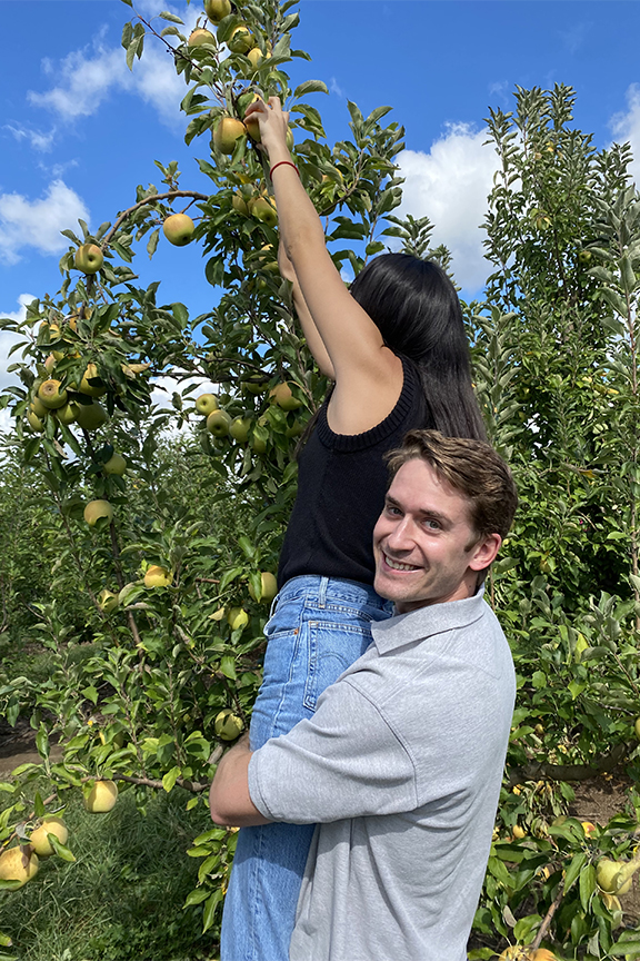 Residents picking apples in an orchard