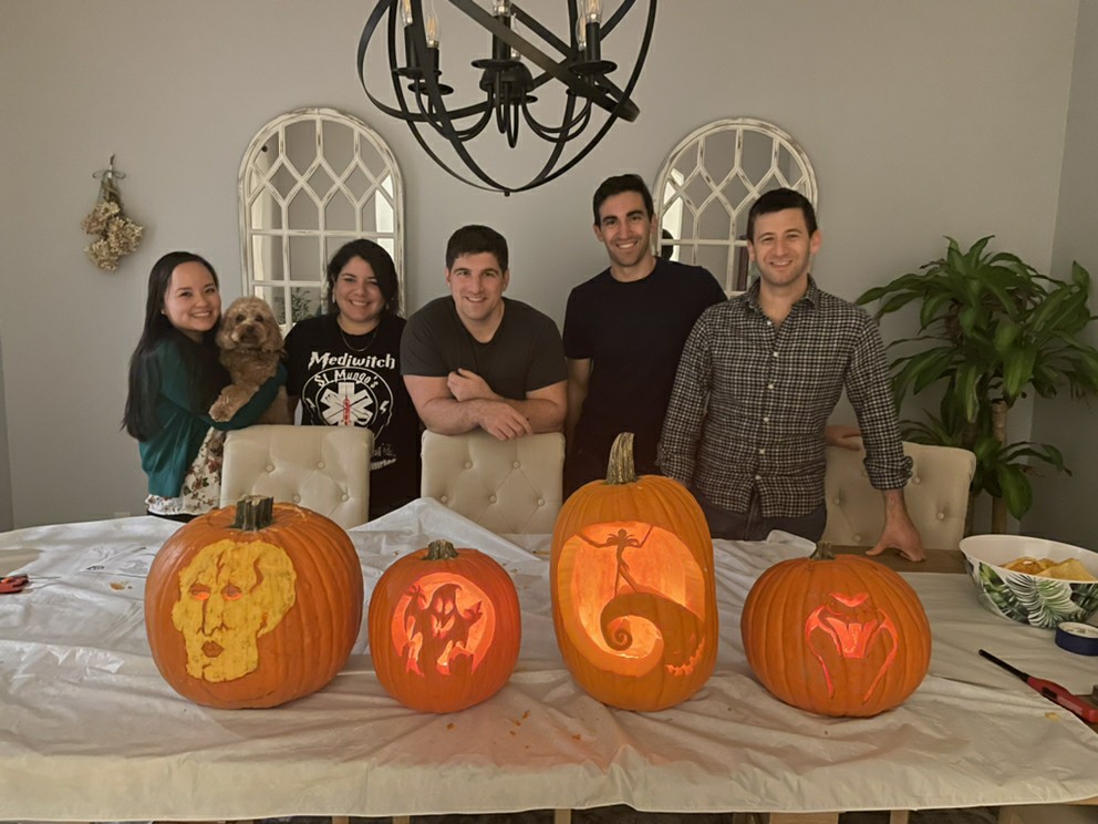 Neurology residents showing off their intricately carved jack-o-lanterns