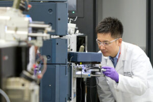 Kanta Horie, PhD, works with a mass spectrometer that he uses to measure protein levels in cerebrospinal fluid samples. Horie and colleagues at Washington University School of Medicine in St. Louis and Lund University in Sweden have discovered that a form of the protein tau in the cerebrospinal fluid known as MTBR-tau243 can be used to track the progression of Alzheimer's disease and could speed drug development.