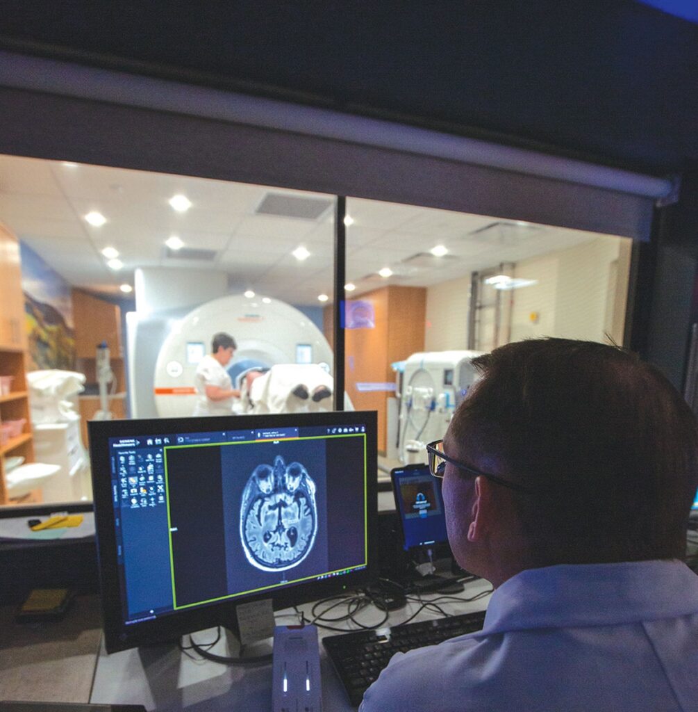 NEUROSURGEON JON T. WILLIE, MD, (PICTURED HERE) AND COLLEAGUES USE HIGH-INTENSITY FOCUSED ULTRASOUND TO TREAT SOME PEOPLE WITH ESSENTIAL TREMOR.