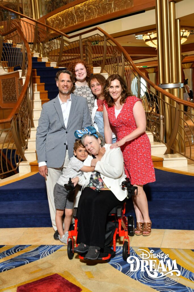 Six members of the Hatch family pose on a Disney cruise ship