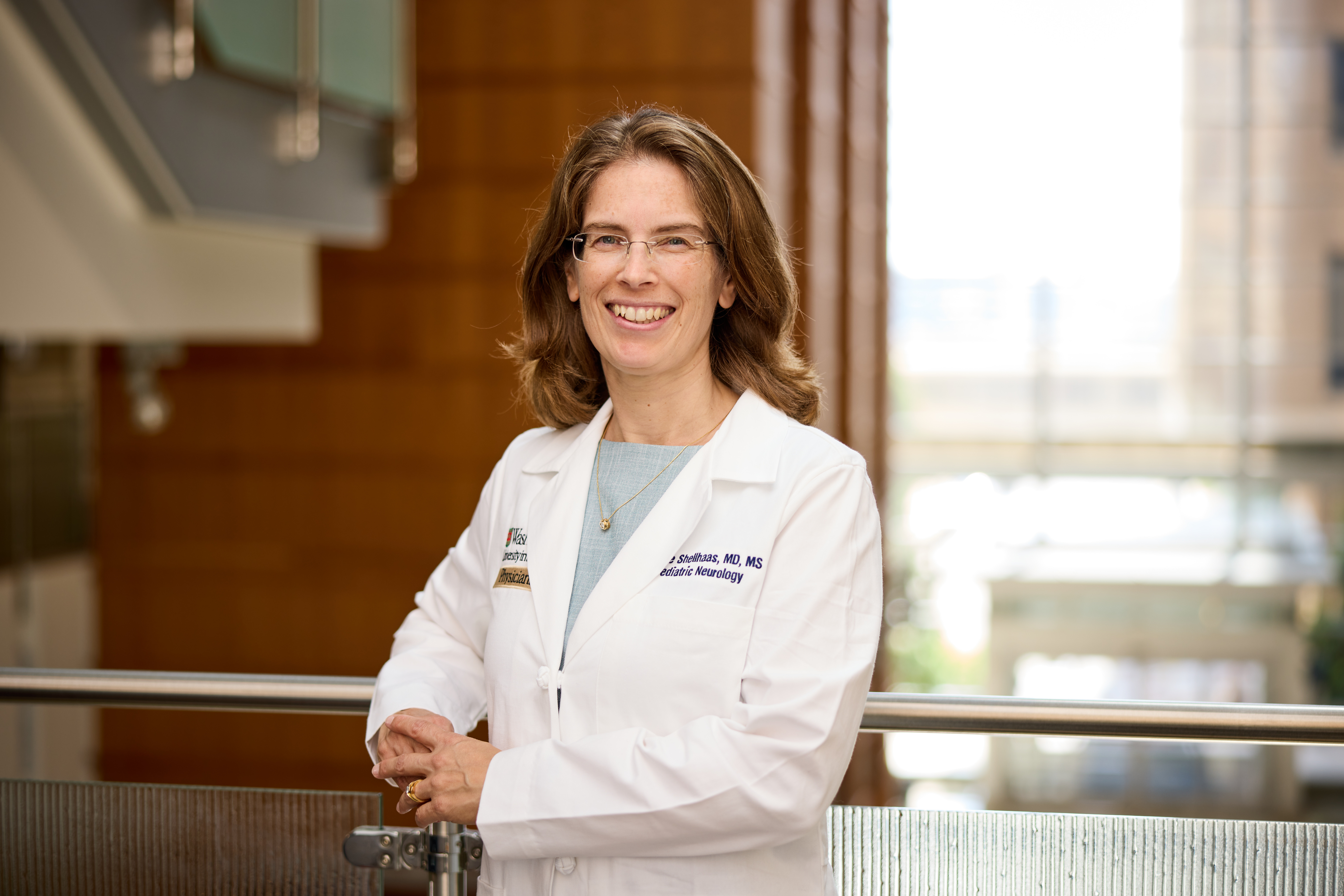 Image of Dr. Renée Shellhaas in a white lab coat.