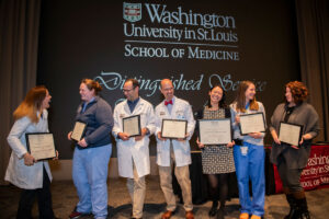 Several of those honored with 2017-18 Distinguished Service Teaching Awards celebrate at the awards ceremony Nov. 15 at the Eric P. Newman Education Center on the Medical Campus.