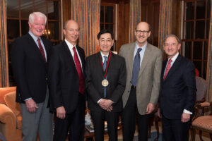 Jin-Moo Lee, MD, PhD, (center) has been named the Norman J. Stupp Professor of Neurology in recognition of his contributions to stroke research. Shown at his installation are (from left) John C. Morris, MD; David Holtzman, MD; Lee; David H. Perlmutter, MD, dean of the School of Medicine and executive vice chancellor for medical affairs; and Chancellor Mark S. Wrighton.