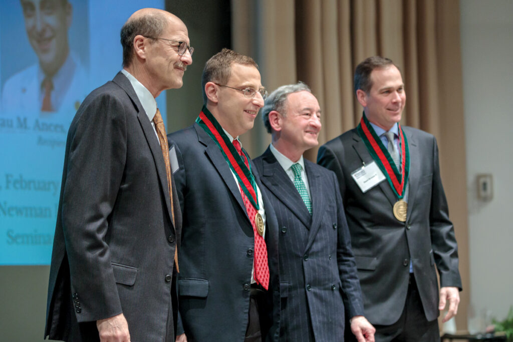 Beau Ances, MD, PhD, MSc, second from left, becomes an endowed professor. Joining in on the celebration are (from left): David H. Perlmutter, MD, executive vice chancellor for medical affairs and dean of the School of Medicine; Chancellor Mark S. Wrighton; and Daniel J. Brennan II.