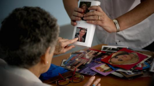 Getty Images A woman with Alzheimer's performs a memory exercise in a nursing home.