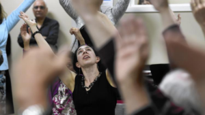 Instructor Laura Richling leads a dance class for Parkinson’s disease patients and their caregivers at Hartford Hospital’s Movement Disorders Center in Vernon. Richling is affiliated with Dancing with Parkinson’s Disease, based in Brooklyn, N.Y., and the Neighborhood Music School in New Haven. (Cloe Poisson / cpoisson@courant.com)