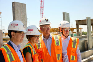 Department heads and other leaders at Washington University School of Medicine in St. Louis recently toured the site where the Neuroscience Research Building is being constructed. The group included (from left) Jin-Moo Lee, MD, PhD, head of the neurology department; Linda Richards, PhD, head of the neuroscience department; David Holtzman, MD, past head of the neurology department; and Gregory Zipfel, MD, head of the neurological surgery department, among others.