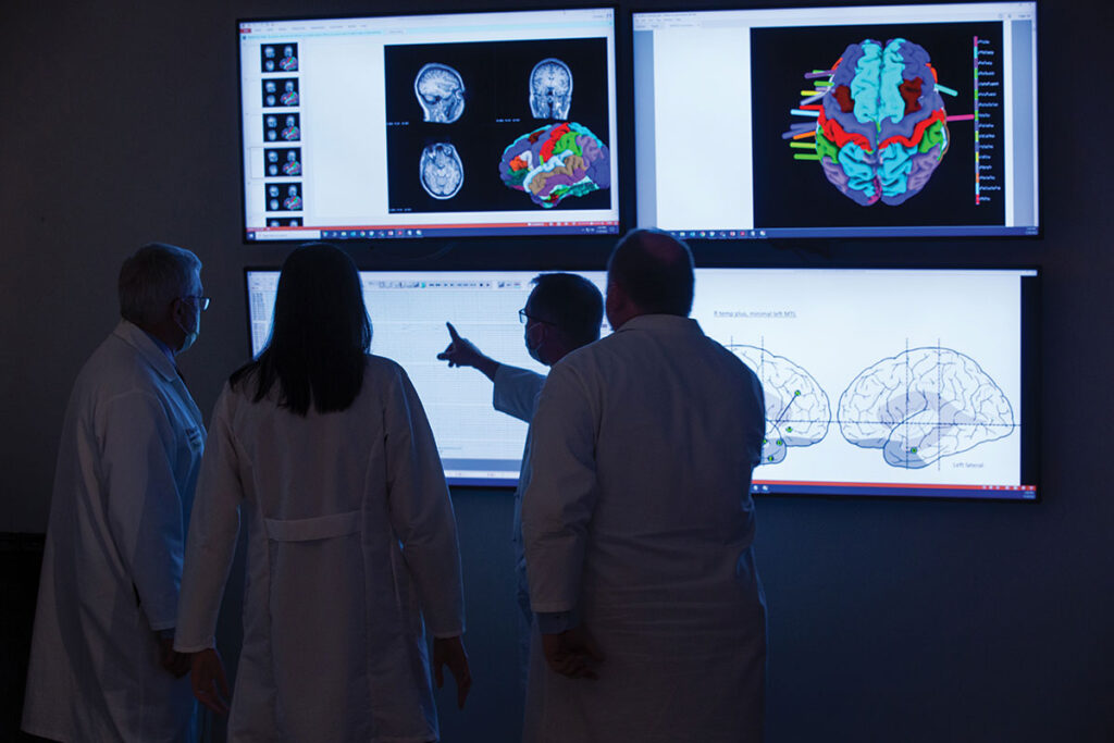 Neurologists look over EEG scans