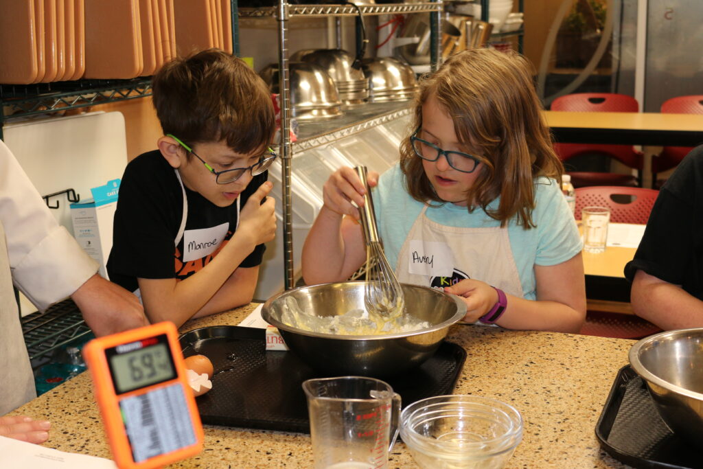 Monroe and Avery learn valuable cooking skills. 